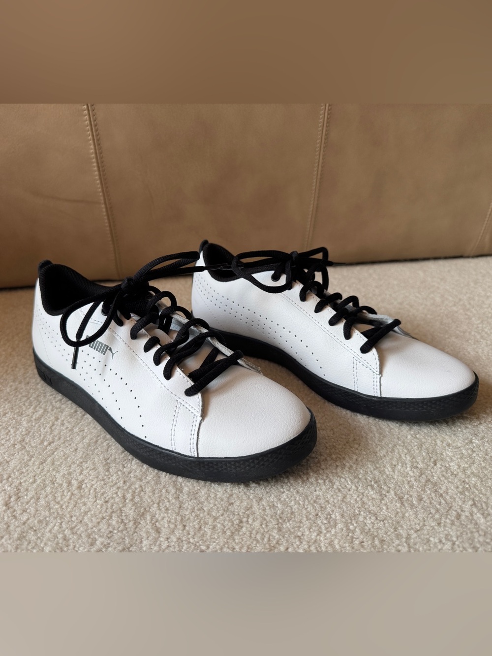 Women’s Pumas- Black and White low top sneakers